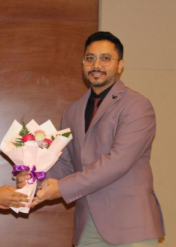 Dr. Khadar receiving recognition